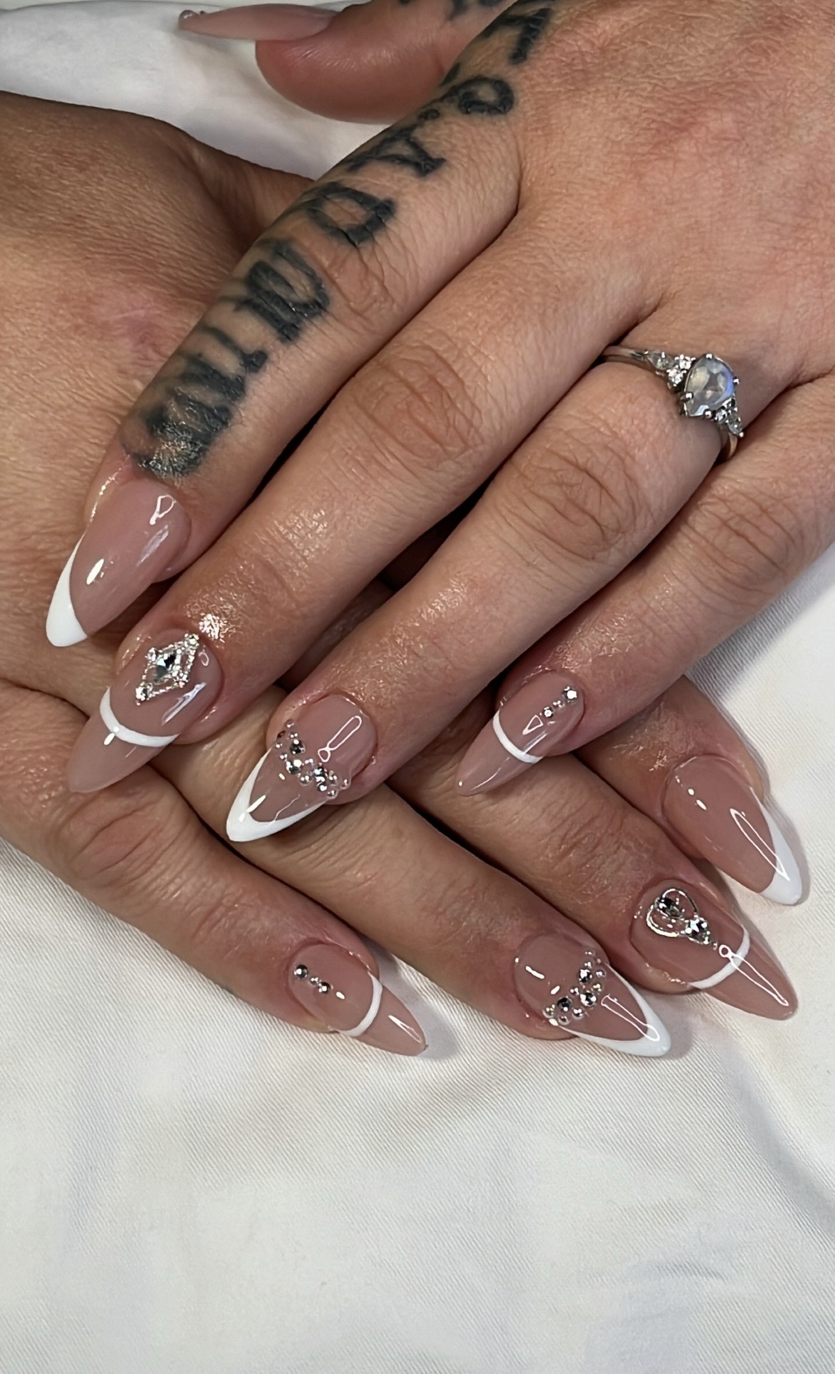 White tip french nail set with fine crystal placement